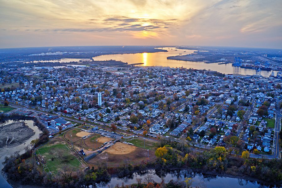 Contact - Aerial View of Delaware Riverfront Town in New Jersey
